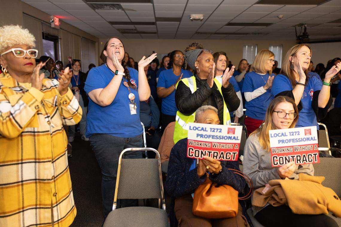 Members of local 1272, The Cahokia Federation of Teachers clap and chant “CFT” after a news conference regarding recent complaints against the school district’s alleged mismanagement of funds and other grievances.