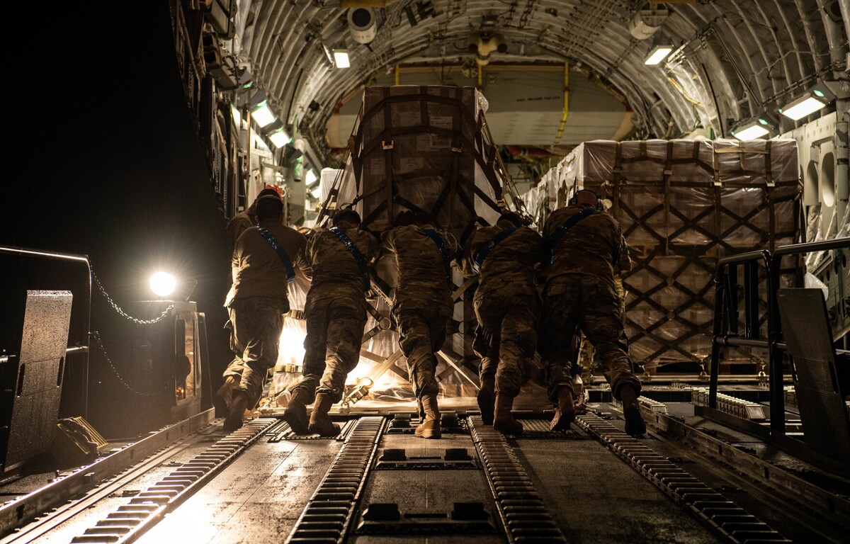 U.S. airmen load a pallet of infant formula onto a C-17 Globemaster lll aircraft at Ramstein Air Base, Germany. President Joe Biden launched Operation Fly Formula to speed up the importation of infant formula from Europe due to critical shortages.