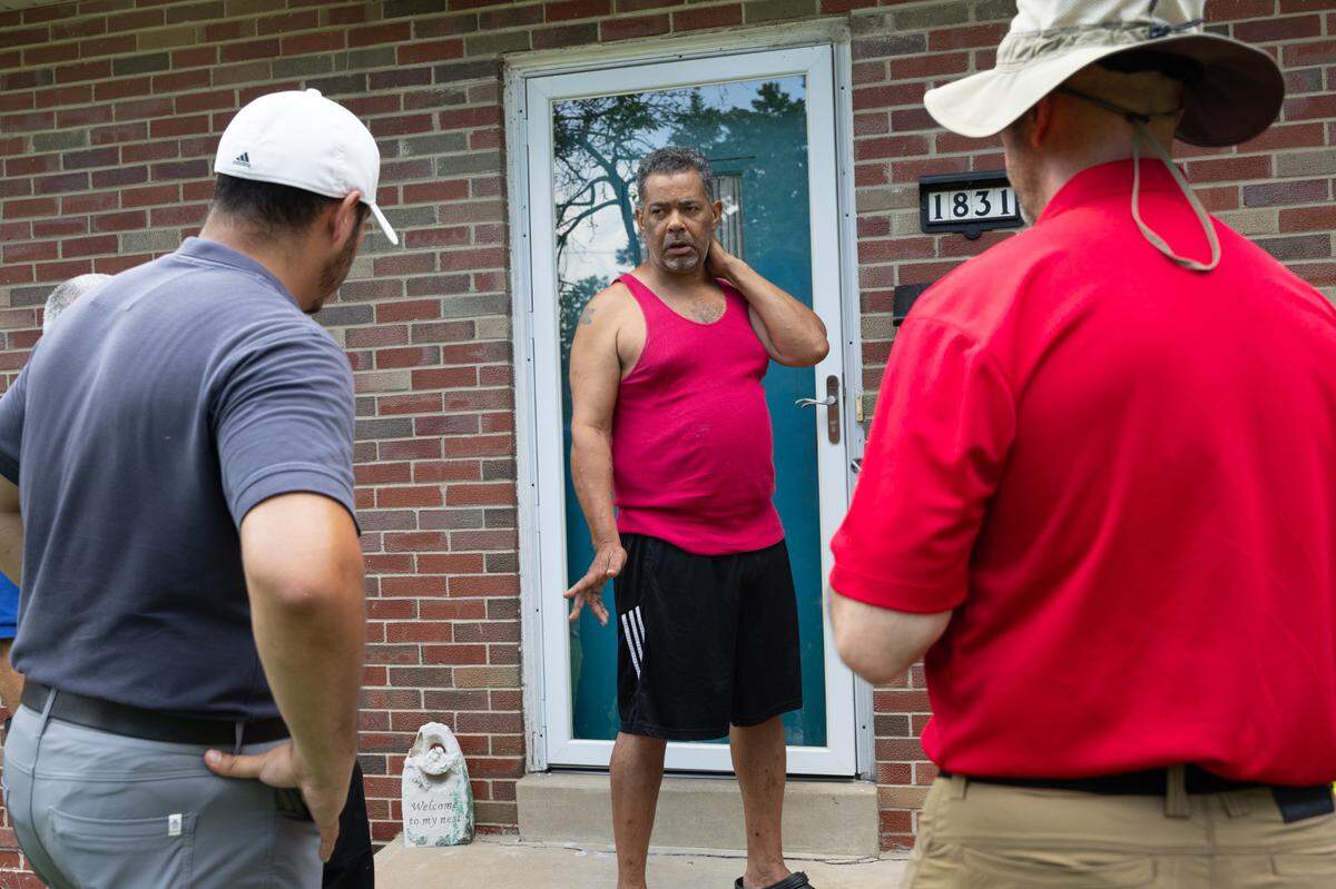 Kevin Barnes, 60, speaks with representatives of an assessment team on July 30, 2024 to discuss damage to his house from heavy flooding in July. St. Clair County has issued a disaster proclamation as a result of the flooding. An assessment team made up of county, state and federal staffers are visiting St. Clair County this week to survey damages.