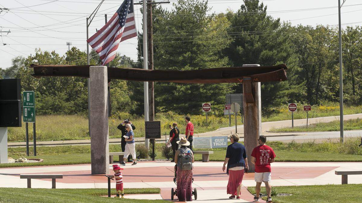 After the annual Moment of Remembrance ceremony honoring the victims of 9/11, attendees visit the September 11 Memorial Walkway of Southern Illinois at 1125 S. Illinois Street in Belleville. The memorial, features a 35.25 foot long steel column from the World Trade Center in New York.