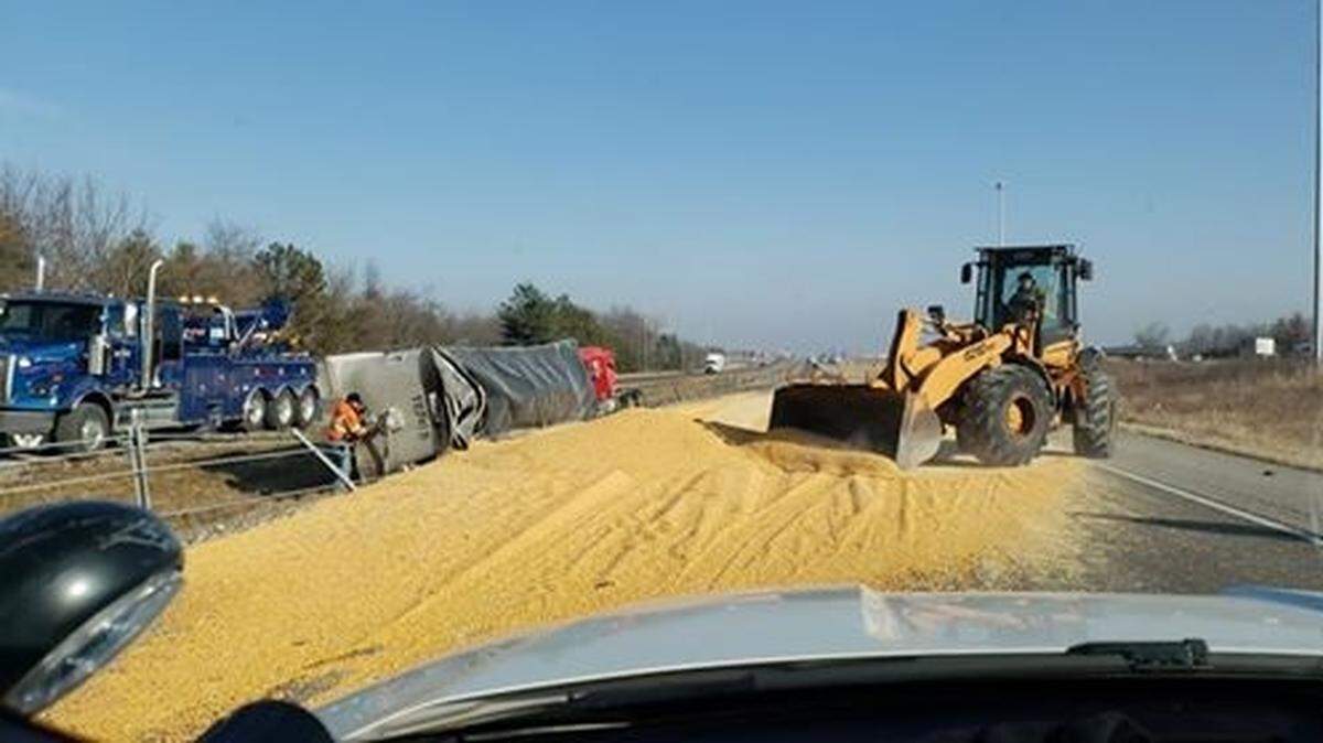 A semi tractor-trailer loaded with agricultural product overturned Monday morning on southbound Interstate 55, spilling the product across at least two lanes of traffic.