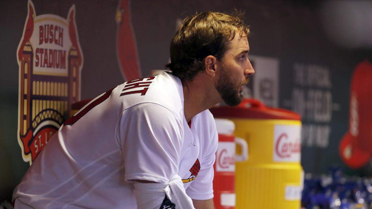St. Louis Cardinals starting pitcher Adam Wainwright sits in the dugout after working during the fourth inning of a baseball game against the Chicago Cubs Tuesday, April 4, 2017, in St. Louis.