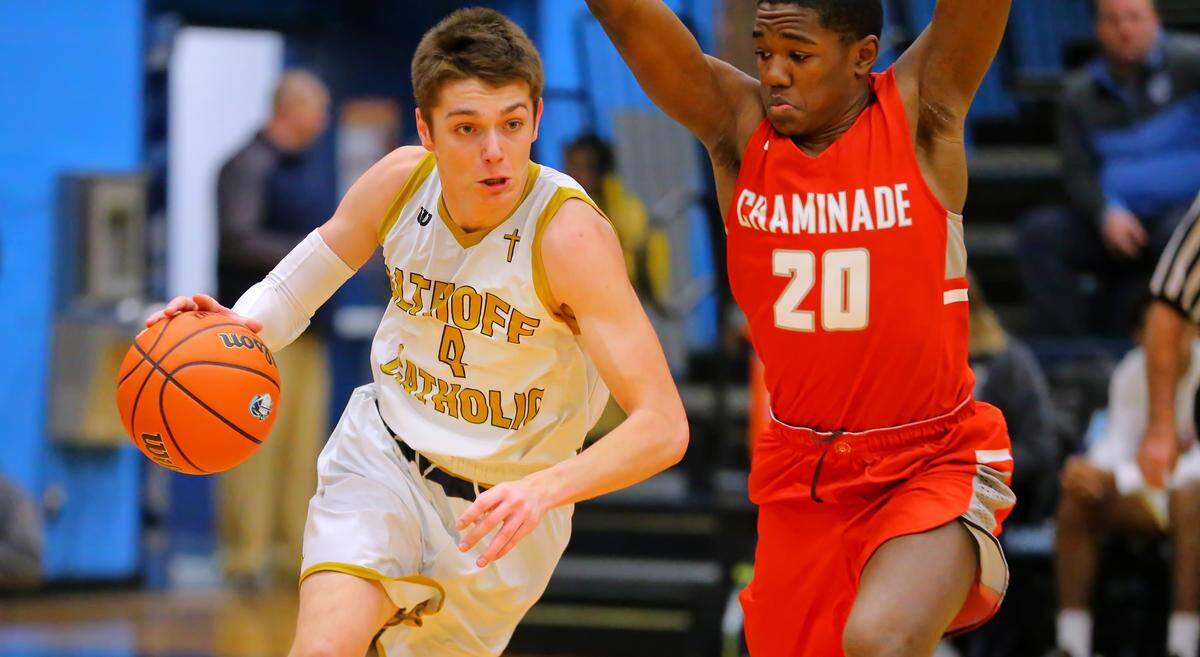 Althoff’s Daulton Burgner drives against Chaminade’s Damien Mayo during Wednesday’s Click-fil-A Classic basketball tournament at Belleville East High School.