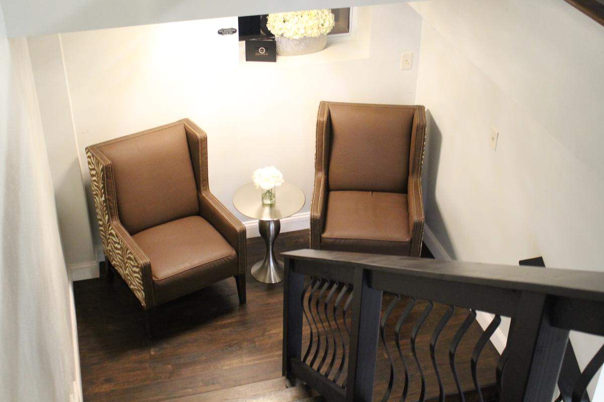 A staircase landing doubles as a small sitting area at Events at The U in Belleville.