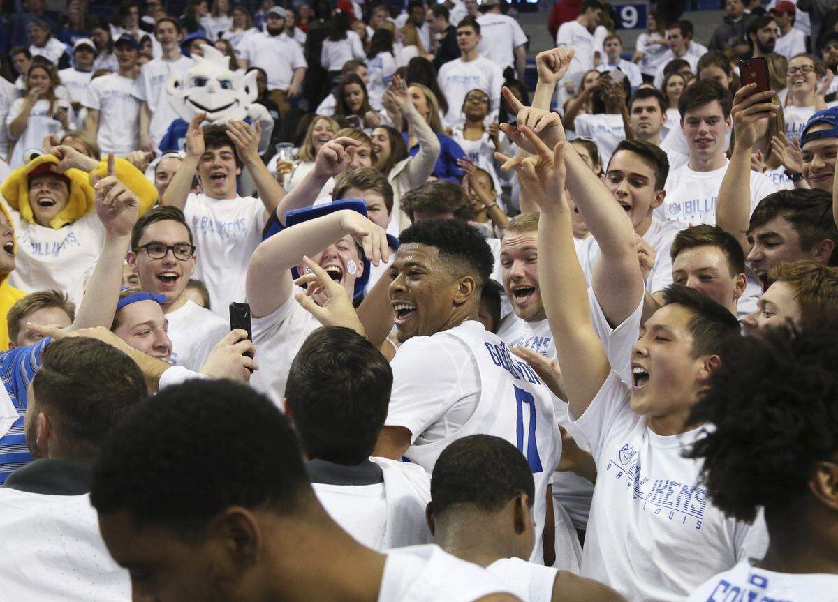 St. Louis guard Jordan Goodwin celebrates with fans in the student section after an NCAA college basketball game against Dayton, Saturday, Jan. 27, 2018, in St. Louis. Saint Louis won 75-65.