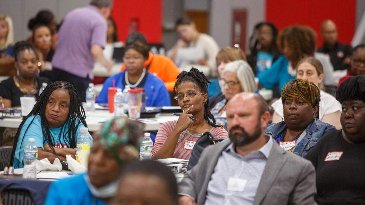Tashonia Hentz listens to Rev. Dr. Starsky Wilson President and CEO of the CHildren’s Defense during the meeting on Childrens Advocat for Change Child Poverty Forum in Southern Illinois University, at Edwardsville East St. Louis Center