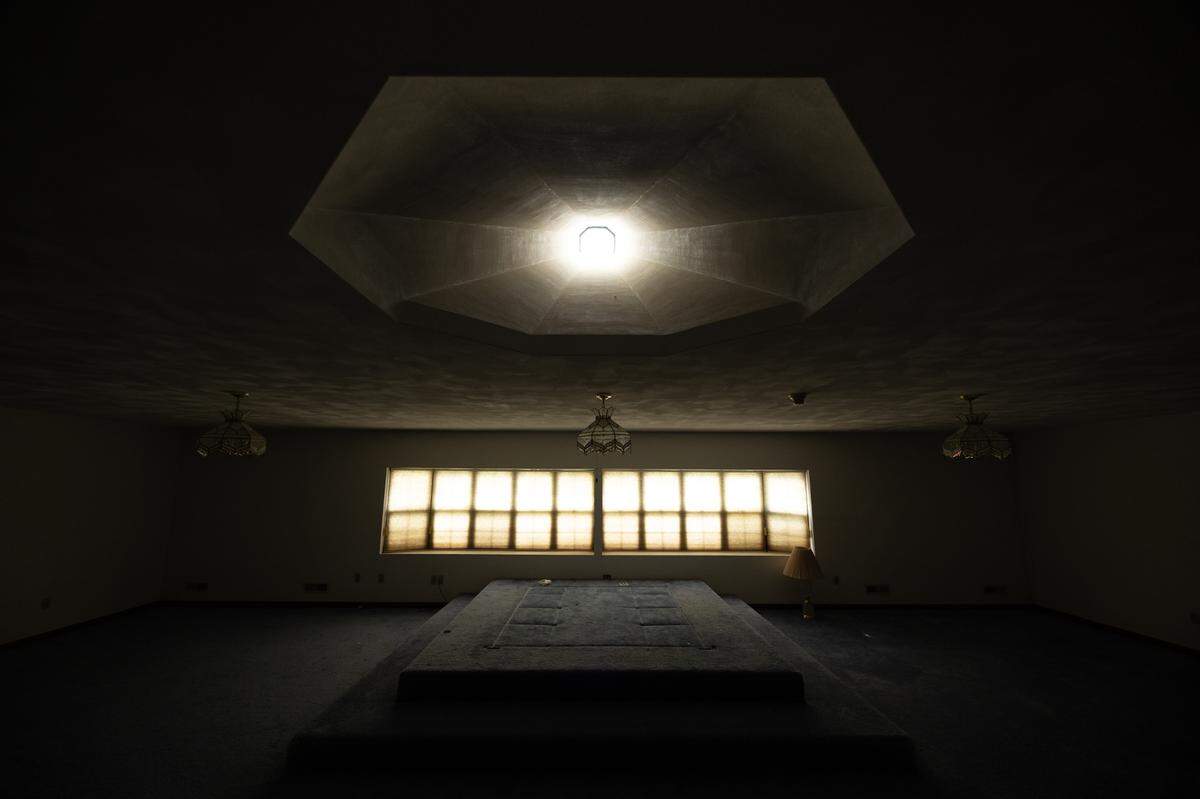 This unique room has a massive skylight in a unique conical shape and a raised dais.