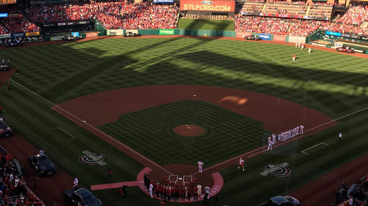 St. Louis Cardinals players enter Busch Stadium on their annual home opener parade Thursday.