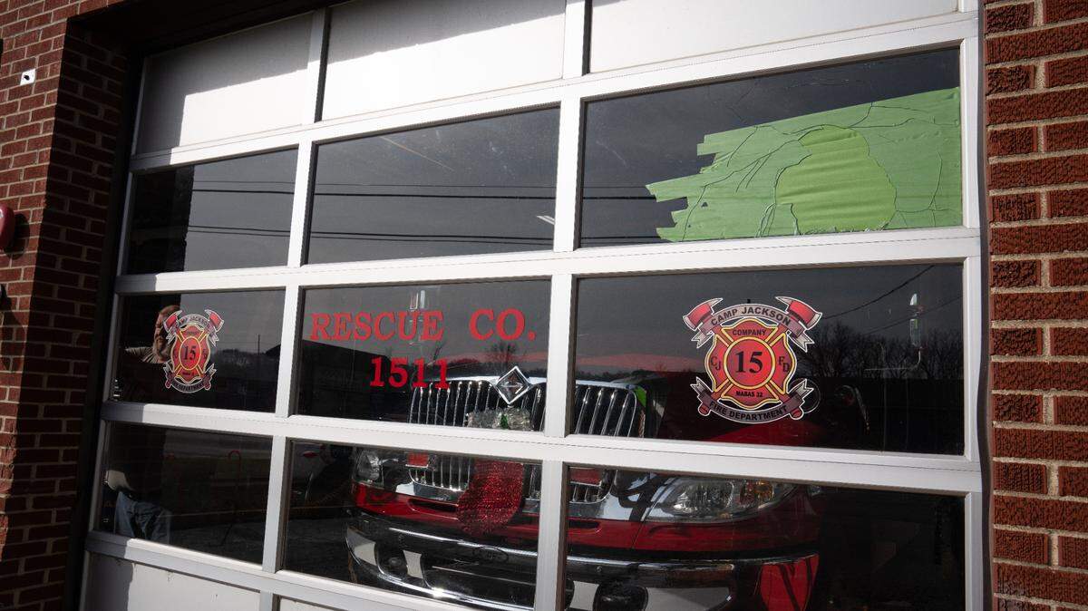 The front window of Camp Jackson Fire Department fire house, which was hit by a stray bullet a couple minutes before midnight on New Years Eve 2023. Chief Chris Davis can be seen in the far right corner.