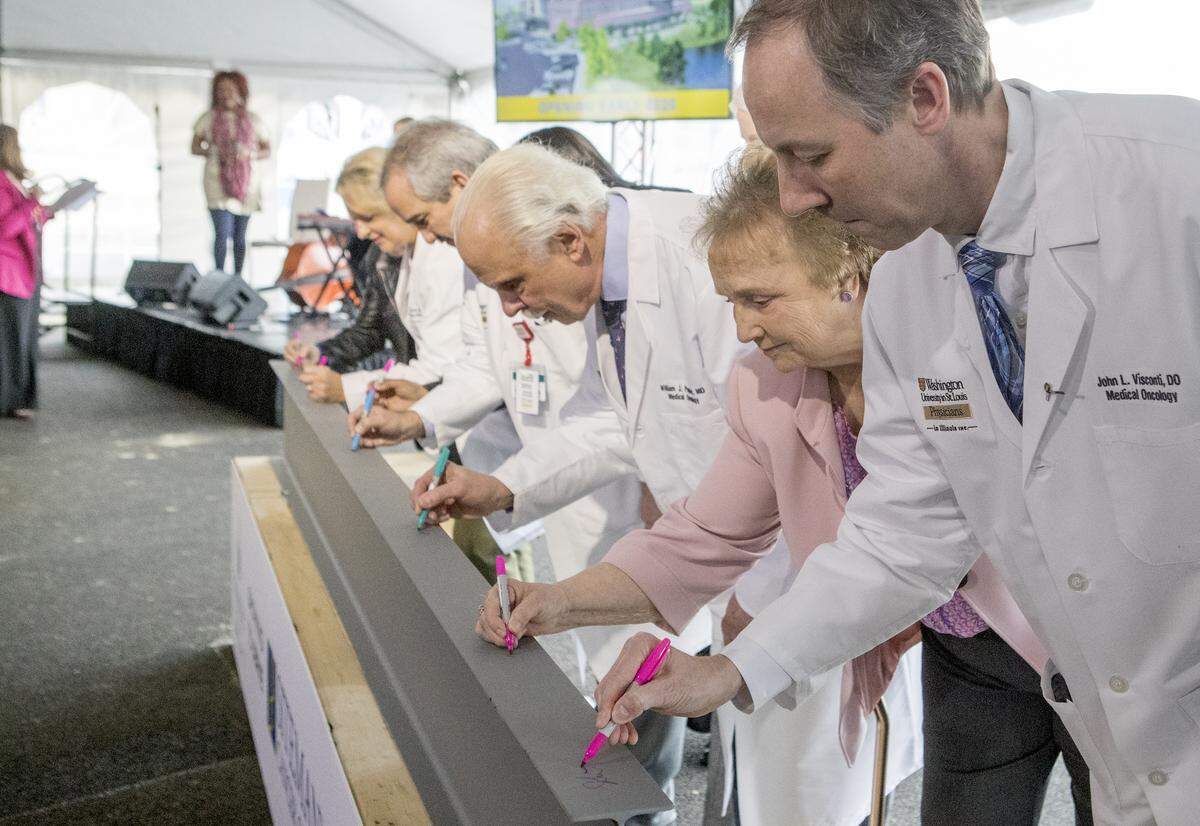 During a ceremonial groundbreaking event, doctors, patients, administrators, guests and civic leaders took turns signing a beam that will be part of the future Siteman Cancer Center location at Memorial Hospital East in Shiloh. Construction has already started on the $38 million, 70,650-square-foot medical office building at Memorial Hospital East that will include Siteman’s sixth location overall. The new location will replace the temporary facility in Swansea.