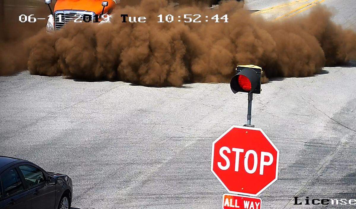 Dust containing toxic heavy metals spills from a PDC Services, Inc. waste hauling truck June 11 onto Illinois 140 in Hamel. The truck was transporting the dust, a byproduct of steelmaking, from Alton Steel, Inc. to PDC’s disposal facility in Peroia when a traffic accident caused the spill.