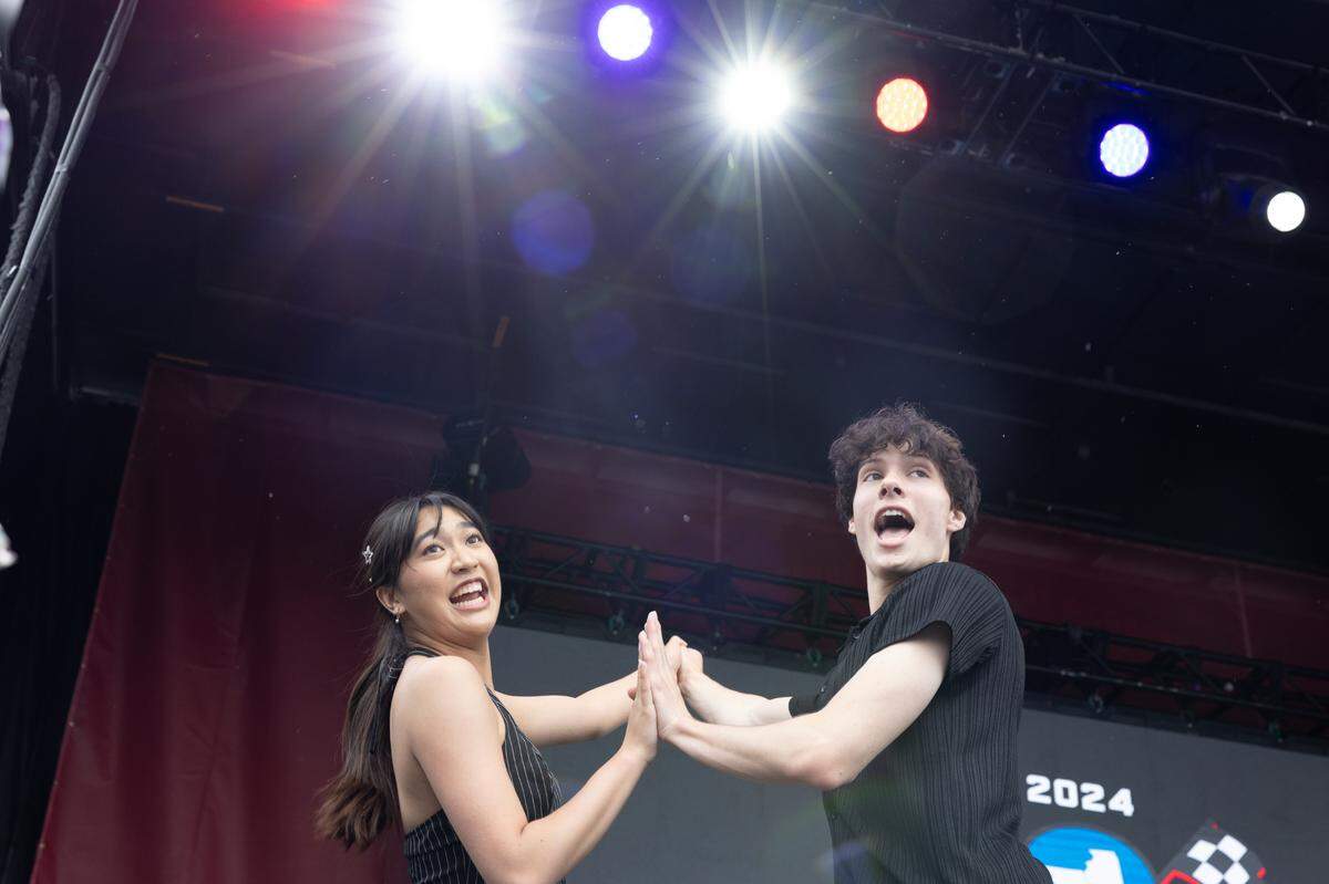 Performers from the Muny Teens sing pop songs during the first day of Enjoy Illinois 300 Cup Race at WorldWide Technology Raceway in Madison, Ill. on June 1, 2024.