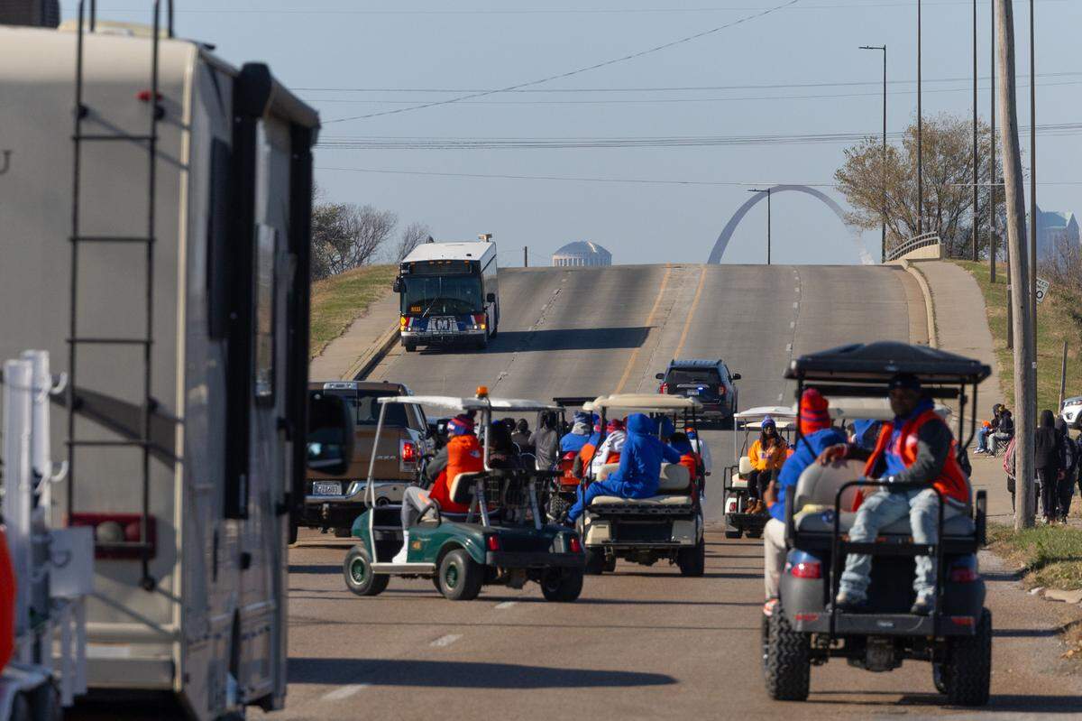 Dozens of golf carts and other vehicles make their way down State Street for the East St. Louis victory parade on Dec. 4, 2024.