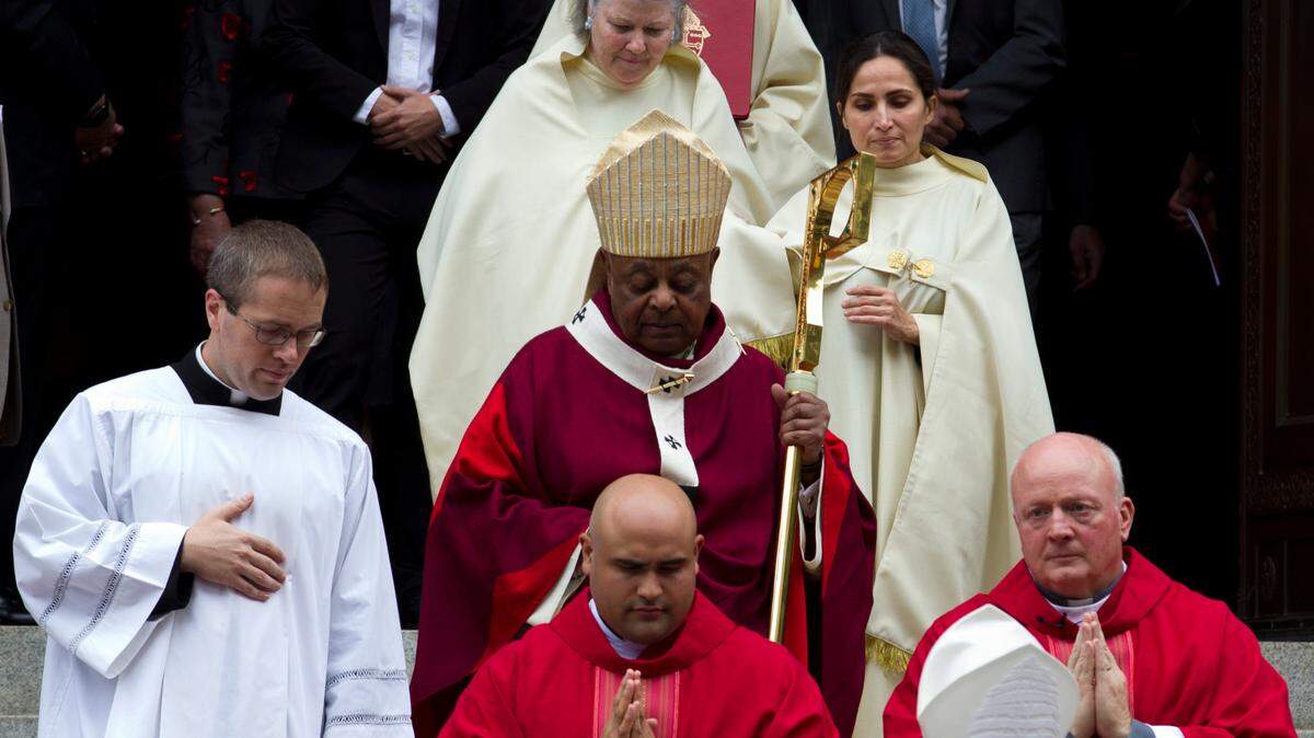 Cardinal Wilton D. Gregory and other clergy leave the Cathedral of St. Matthew the Apostle in 2019.