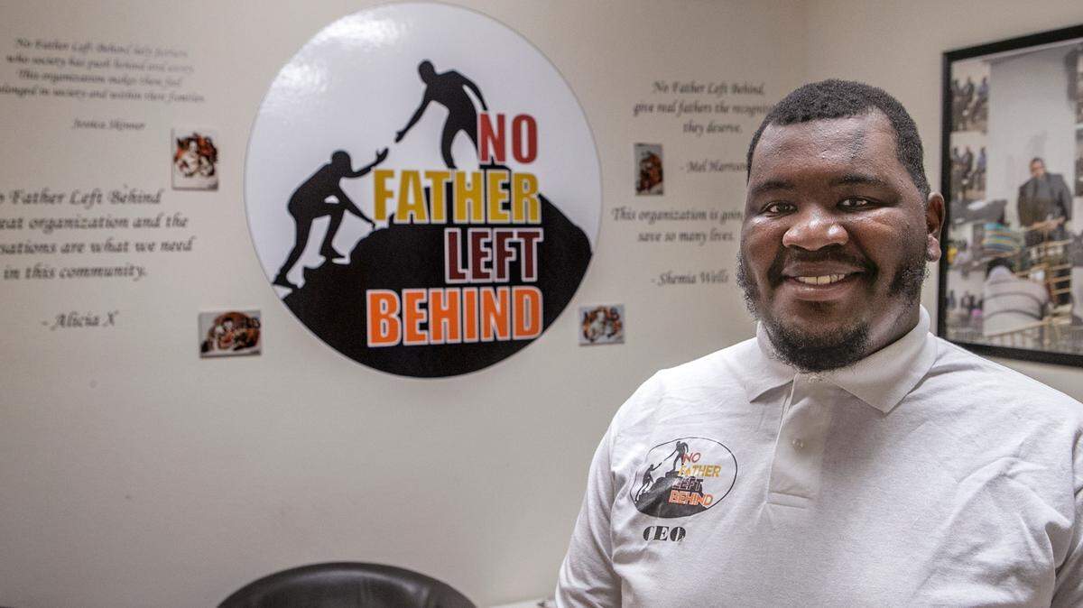 Shaquille Armstrong, executive director of No Father Left Behind, stands inside the new headquarters of the nonprofit group on Lincoln Place Ct. in Belleville.