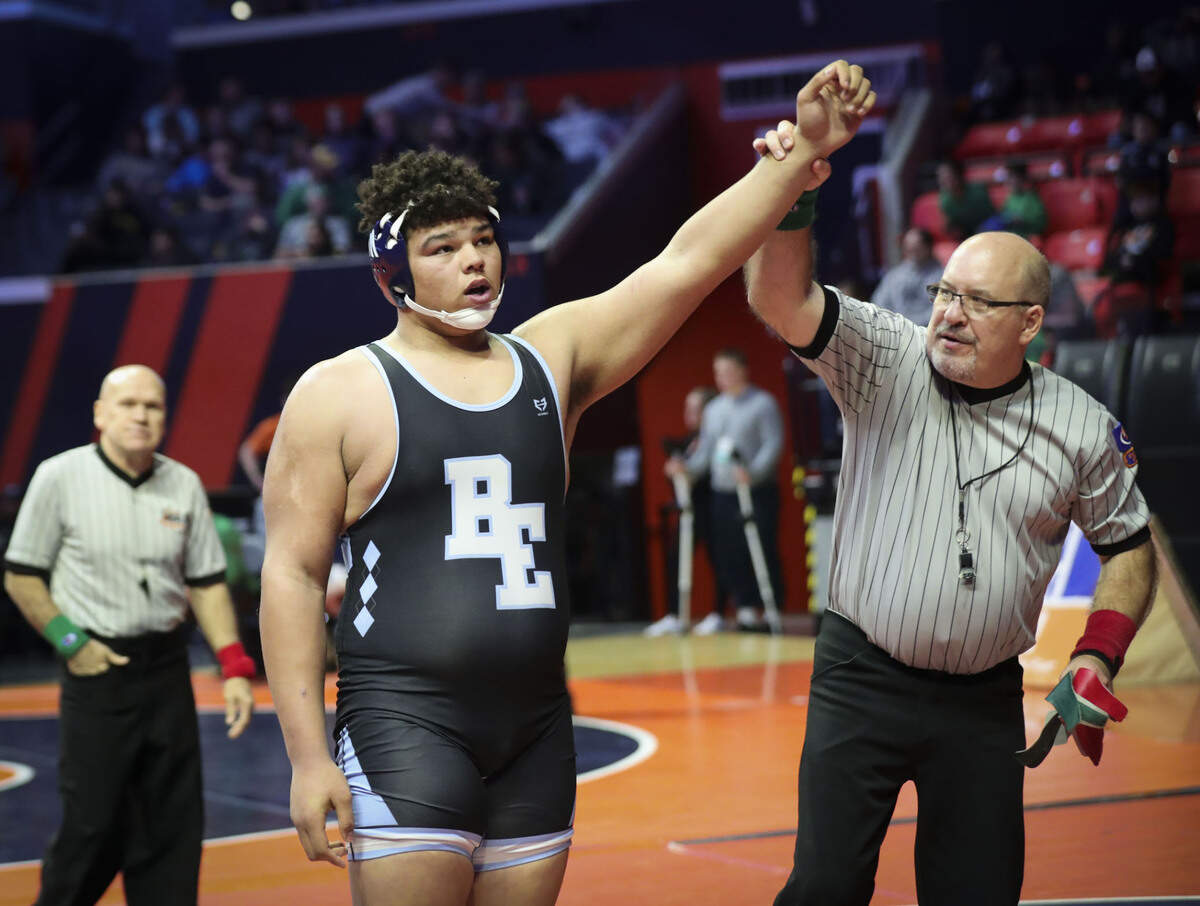 Belleville East’s Jonathan Rulo has his hand raised after defeating Hampshire’s Joey Ochoa in their preliminary match at the 2023 IHSA Individual Wrestling State Finals on Thursday in Champaign.