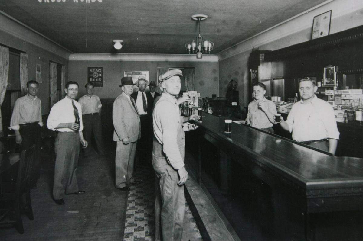 Customers toast at Adam Becherer’s tavern in 1934, a year after he constructed the brick building. From 1977 to 2017, it housed Dandy Inn Irish Pub & Restaurant.
