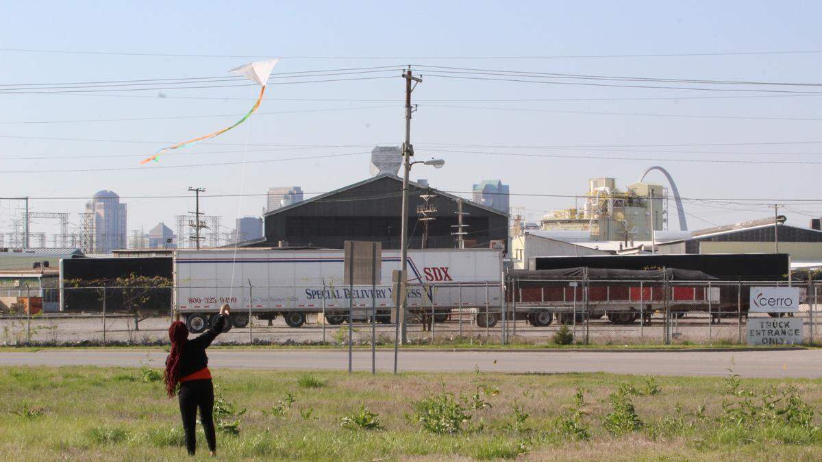 East St. Louis resident Janaha Stennis, 17, flies a kite with the words “Earth Day 2021” written on it at a rally organized by United Congregations of Metro East in Sauget on Thursday, April 22, advocating for the Clean Energy Jobs Act and banning the incineration of PFAS chemicals.