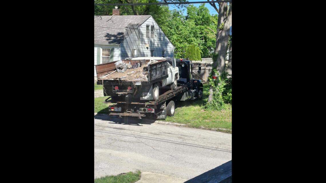 A flatbed tow truck was used on Wednesday to remove five vehicles that Belleville police deemed to be derelict on three properties owned by George Green on South 19th Street.