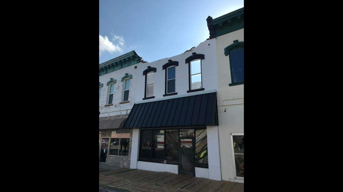 A brick facade is all that’s left standing after a historic building in downtown Litchfield collapsed on Saturday. A bridal shower was taking place on the lower level, but all 21 people escaped.