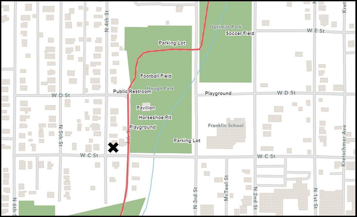 An X marks the location of a derelict home at 321 W. C St. in Belleville. Its detached garage is separated from Hough Park by the East Belleville Bikeway trail (shown by red line).