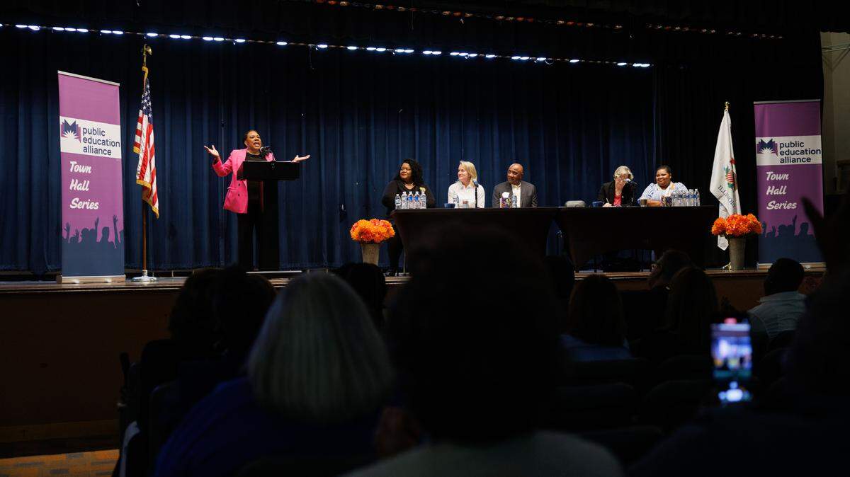 National Education Association President Becky Pringle speaks to a crowd at East St. Louis Senior High School about federal budget cuts to education under the current presidential administration during a town hall meeting hosted by Public Education Alliance May 29 in East St. Louis, Illinois.