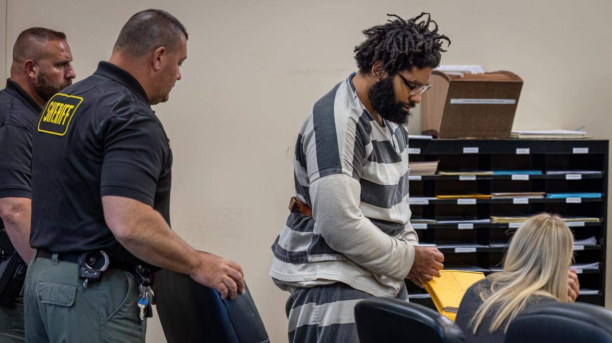 Madison County sheriff’s deputies lead Zachary Capers into an Edwardsville courtroom for a hearing Tuesday. He pleaded guilty but mentally ill to first-degree murder in the 2019 stabbing deaths of Lois and Michael Ladd.