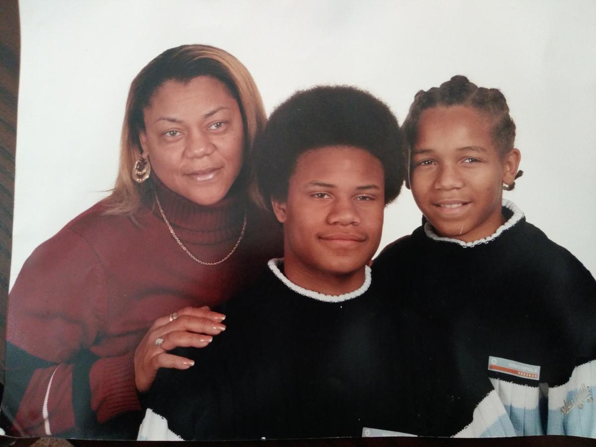 Mother Audrey Crymes and sons Justen, center, and Larry
