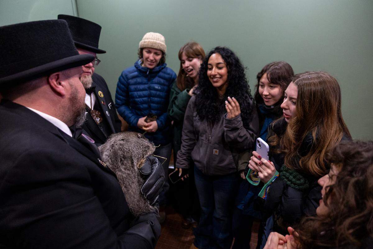 Penn State students get a close-up view of Punxsutawney Phil inside The Press Cider and Craft Beverage Tap House on Saturday, Jan. 17, 2026 in State College.