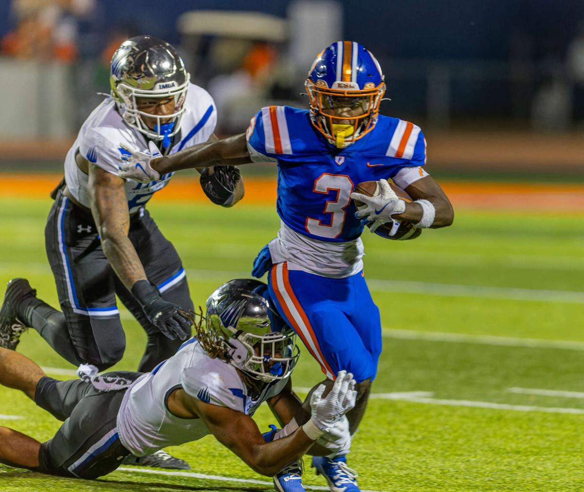 Christopher Bennett Jr. (3) carries the ball against IMG Academy at Clyde Jordan Stadium Friday.