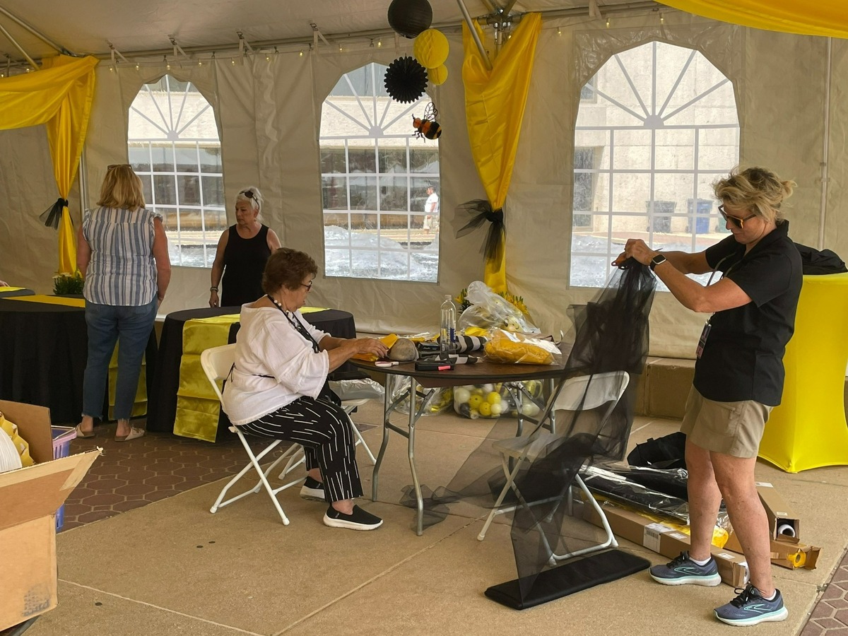 Carol Bartle, co-director of Belleville’s Art on the Square, works with her team to set up the for the 21st annual fine arts show. The show begins Friday afternoon and runs through Sunday around Public Square in Belleville