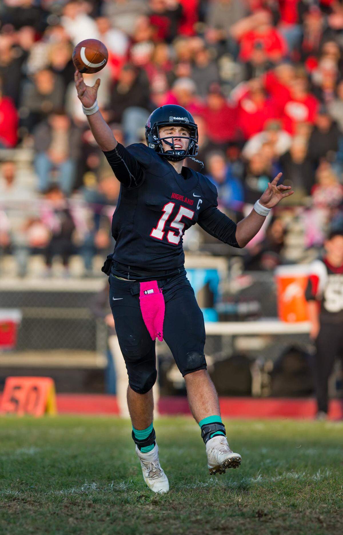 Highland’s Jack Etter attempts a pass against Rich Central in the 5A football playoff game Saturday.