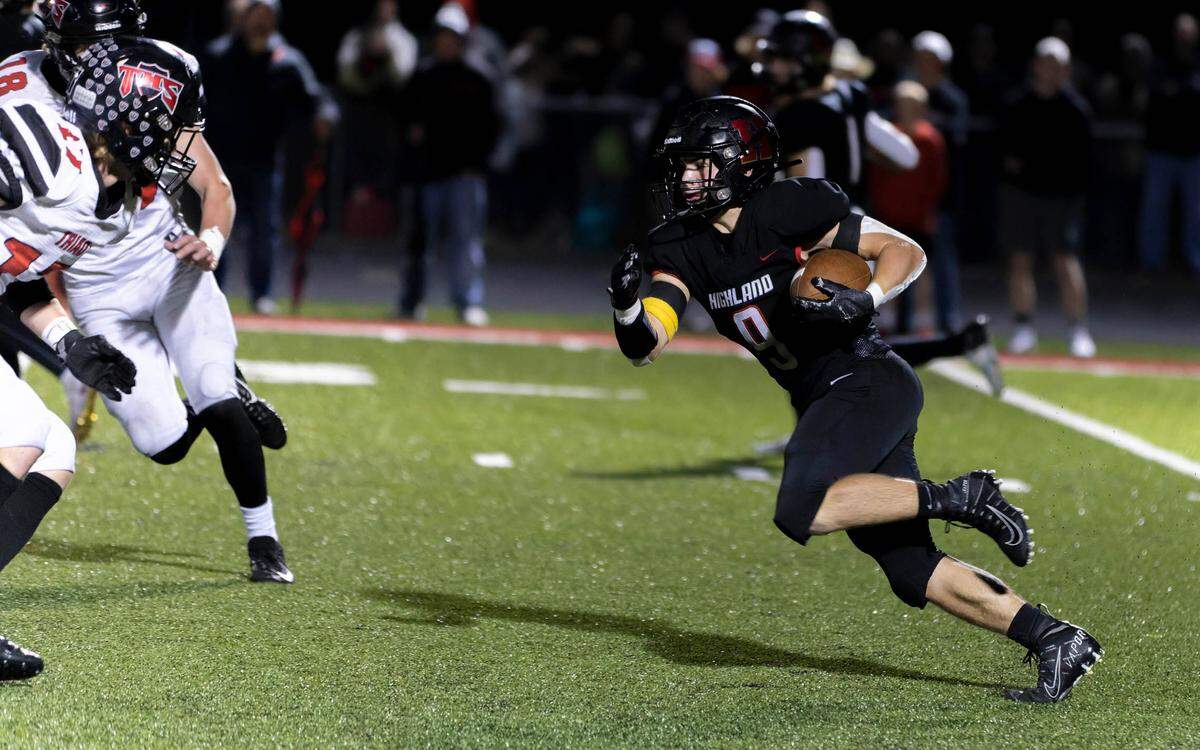 Highland Dylan Beadle runs the ball against Triad during Friday night’s Mississippi Valley Conference game. The host Bulldogs ultimately posted a 35-0 decision.