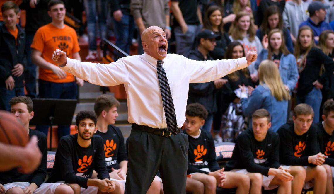 Longtime Edwardsville boys basketball coach Mike Waldo at his last home game with the Tigers.