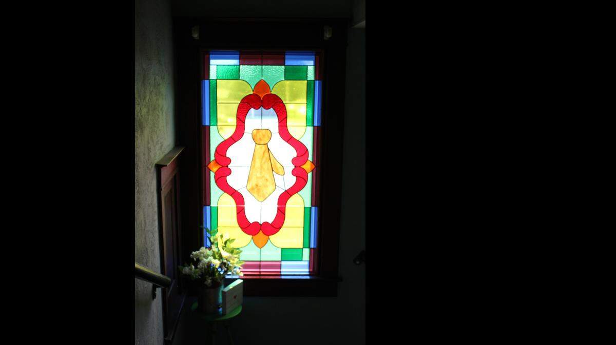 The Jacksons tried to maintain the historic character of a 1920 home they renovated into the Wooden Tie Cafe in Pierron, but they couldn’t resist adding a custom stained-glass window with a tie in it.