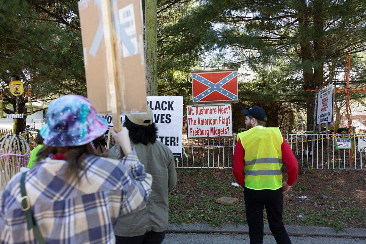 A group of about 25 protesters gather outside the home of Stewart Lannert in the 300 block of South 29th Street in Belleville in 2024. They were objecting to his political signs, which they viewed as racist. 