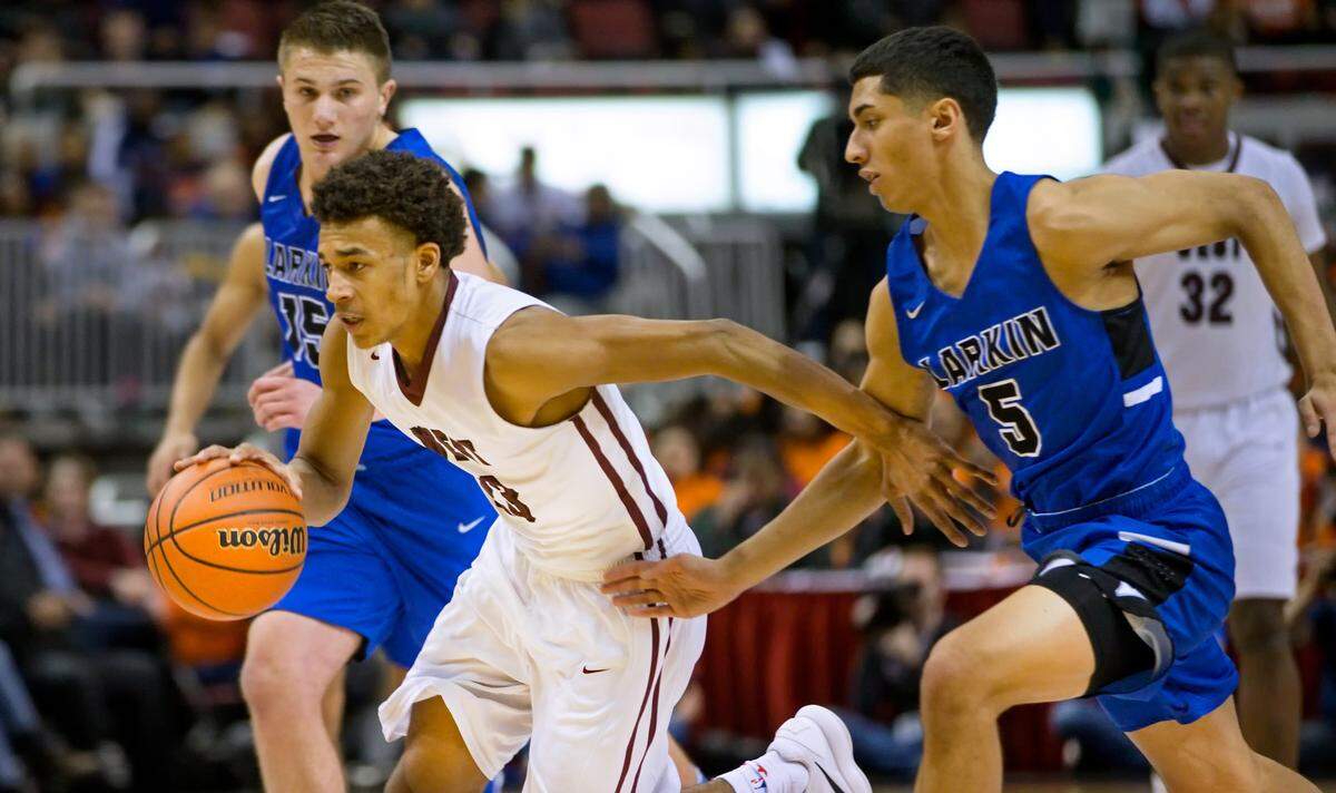 Belleville West's Curtis Williams drives against Elgin Larkin's Victor Perez in Friday's IHSA Class 4A state semifinal game.