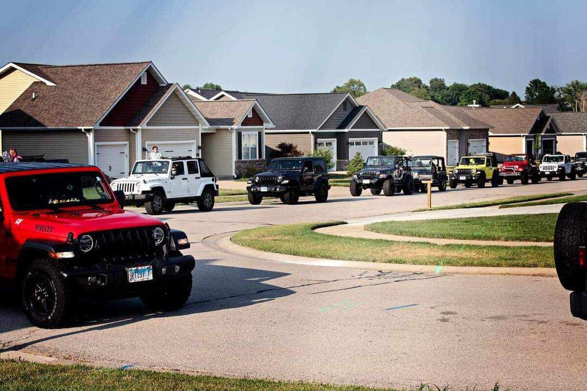 An estimated 100 Jeeps rolled through an O’Fallon neighborhood to wish Airmoise Herman a happy 14th birthday.