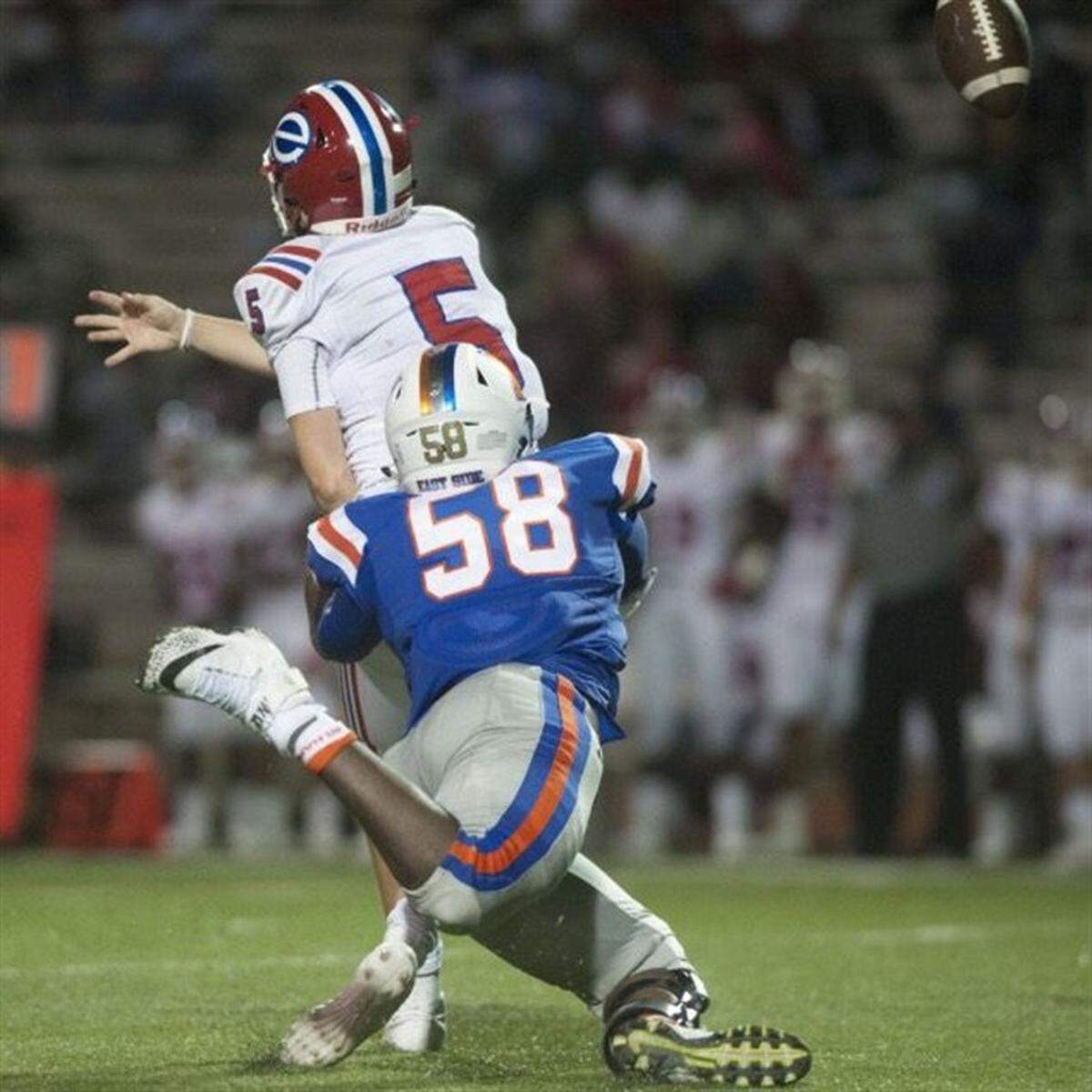 Demond Taylor, No. 58, makes a tackle last season against Evangel Christian High School.