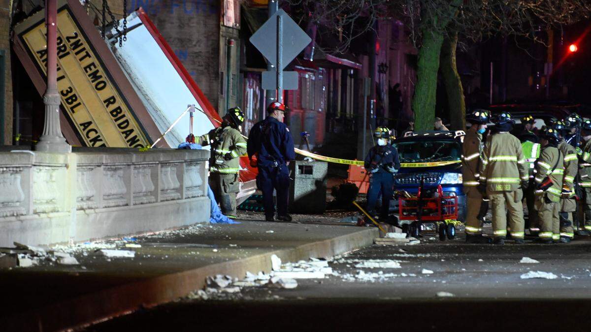 Authorities work the scene at the Apollo Theatre after a severe spring storm caused damage and injuries during a concert, late Friday, March 31, 2023, in Belvidere, Ill. (AP Photo/Matt Marton)