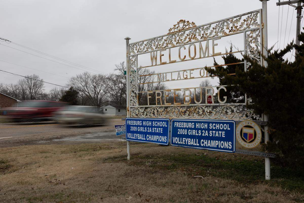 Cars zoom past the Freeburg, Illinois welcome sign on Tuesday, Feb. 17, 2026. 