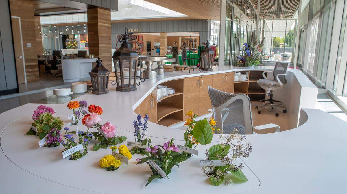 A sample of blooming flowers at the Missouri Botanical Garden can be seen at the information desk inside the new 90,000 square feet Jack C. Taylor Visitor Center. The $95 million project was designed to enhance the visitor experience.