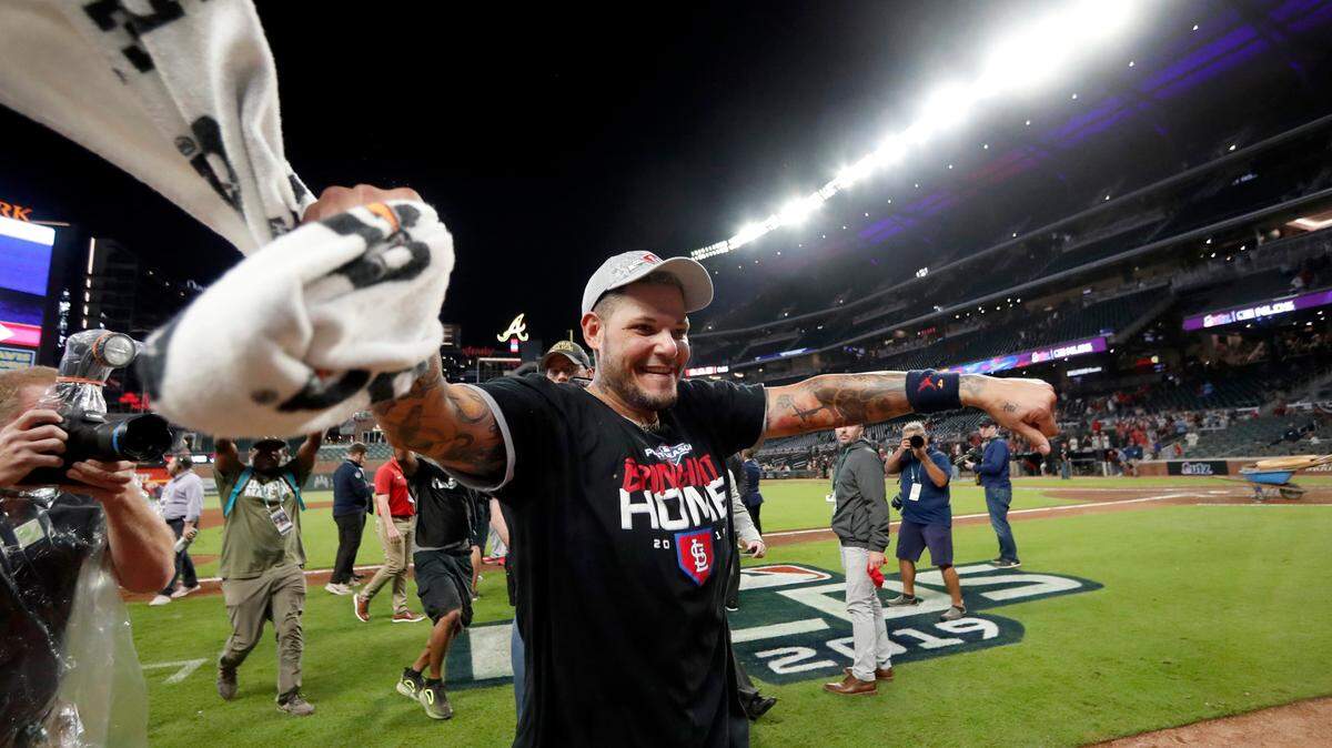 St. Louis Cardinals catcher Yadier Molina celebrates after the Cardinals beat the Atlanta Braves 13-1 in Game 5 of their National League Division Series in October. Molina is seeking a contract extension from the Cardinals, who just came to terms on an extension for teammate Adam Wainwright.