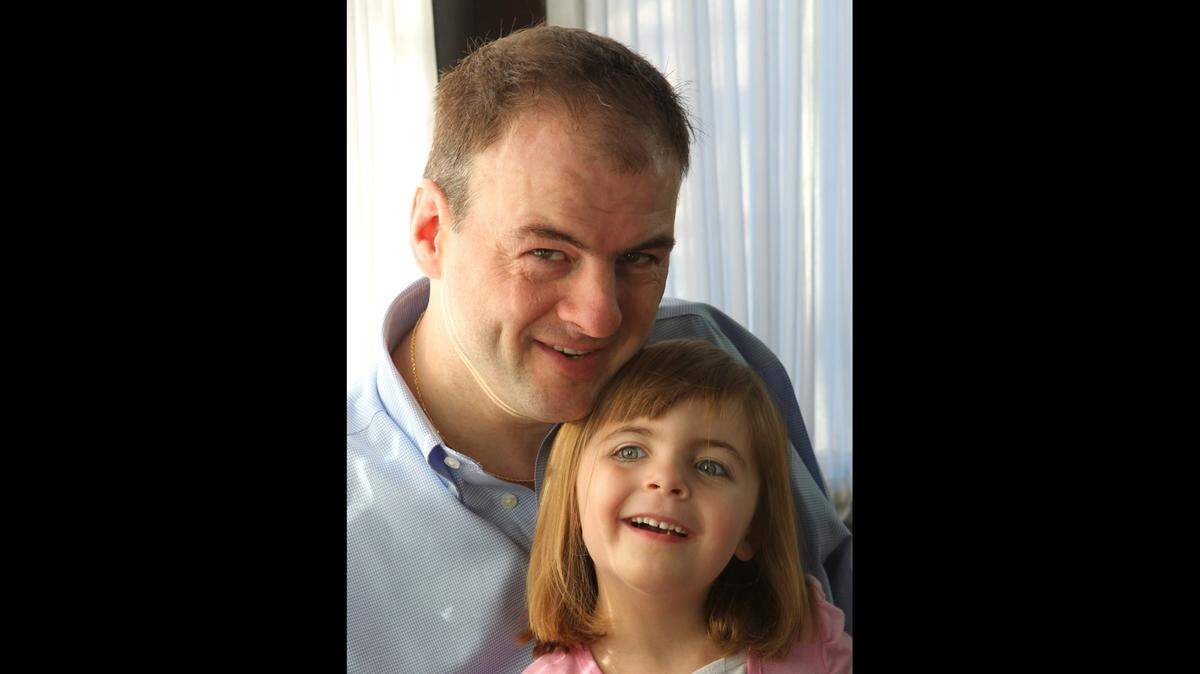 John Foppe, 41, of Breese, poses with his 4-year-old daughter, Faith.