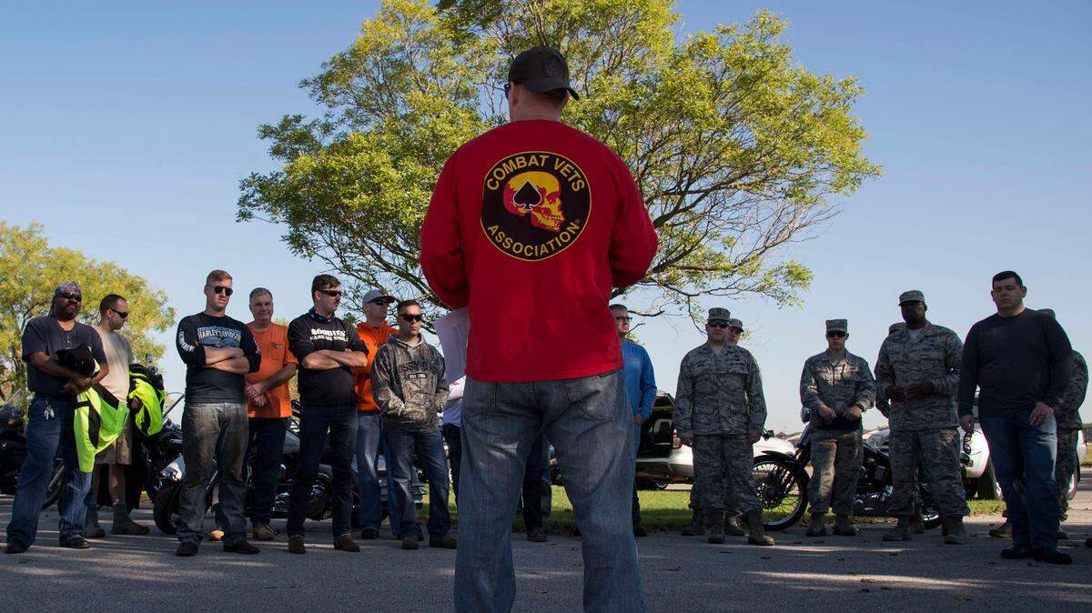 Senior Master Sgt. John Roskom, 375th Air Mobility Wing Plans, Programs and Readiness superintendent, gives a safety briefing to a group of motorcyclists during the Motorcycle Mentorship Ride.
