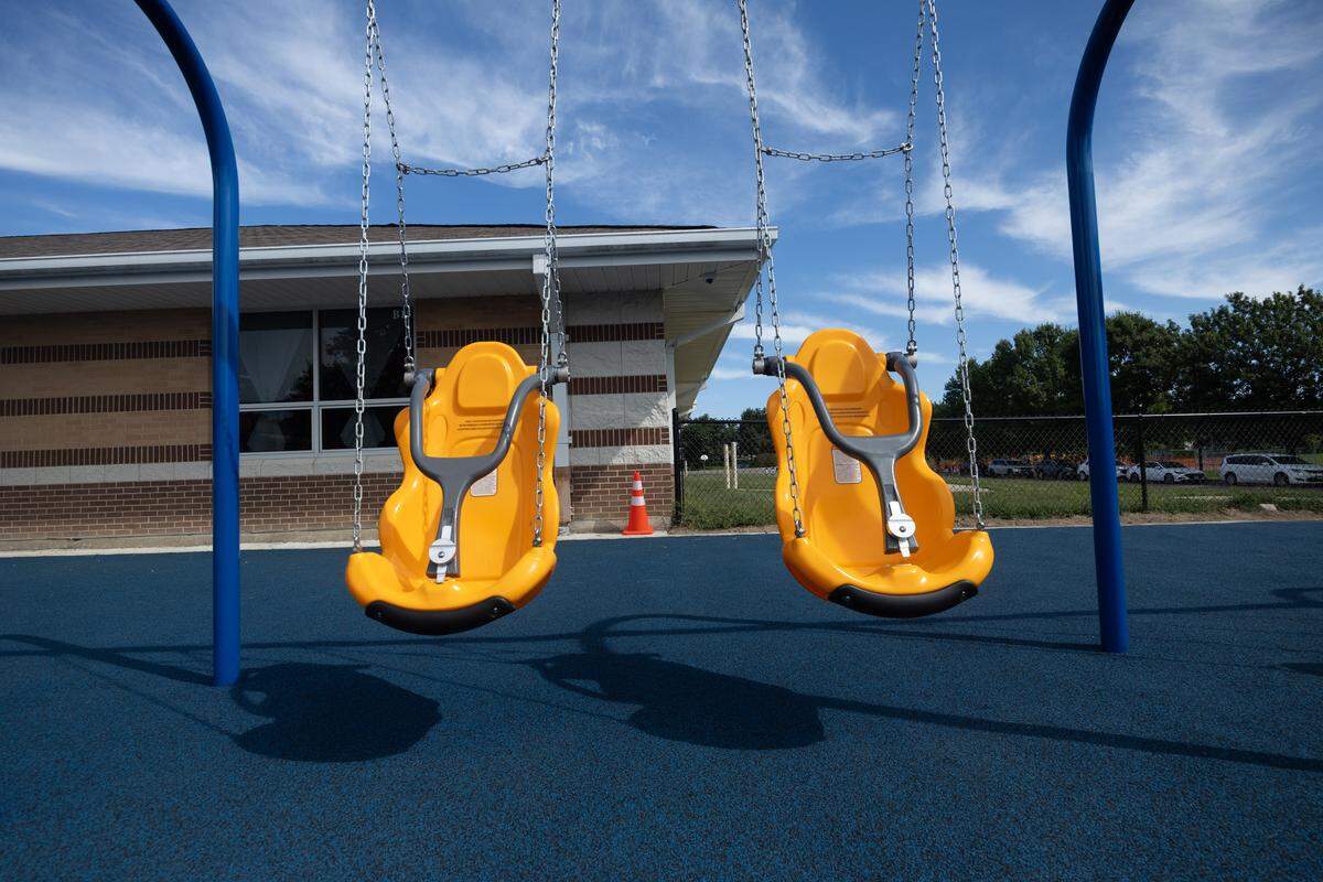 Specially-designed swings provide a safe swinging experience for children with disabilities.