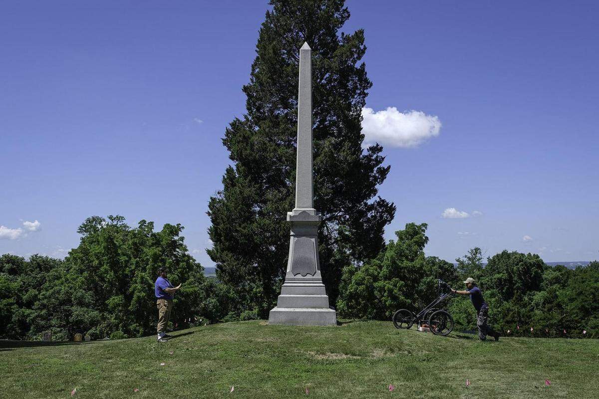 Jameson Young (left) and Felipe Nava, part of the SIU Archaeology Field School, use a ground penetrating radar to map a portion of the Fort Kaskaskia State Historic Site in hopes of locating the stockade of an American fort from the early 1800s near Ellis Grove.