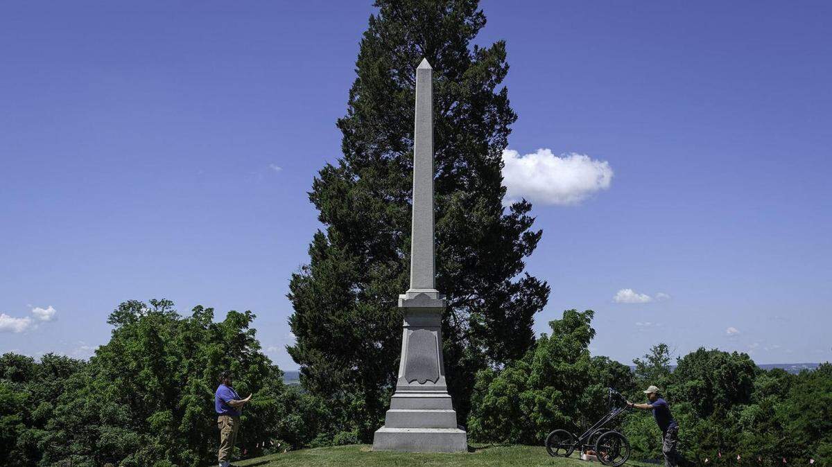 Jameson Young (left) and Felipe Nava, part of the SIU Archaeology Field School, use a ground penetrating radar to map a portion of the Fort Kaskaskia State Historic Site in hopes of locating the stockade of an American fort from the early 1800s near Ellis Grove.