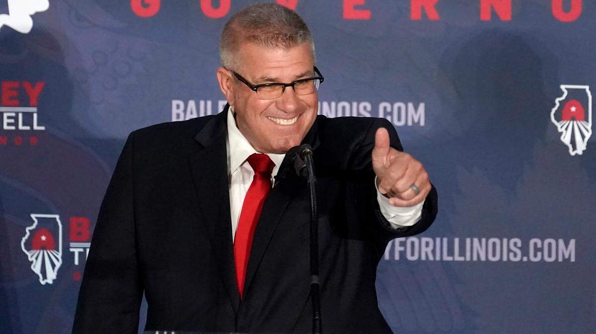 Republican gubernatorial candidate Illinois state Sen. Darren Bailey gestures to the crowd after winning the Republican primary Tuesday, June 28, 2022, in Effingham, Ill. Bailey will now face Democratic Gov. J.B. Pritzker in the fall. (AP Photo/Charles Rex Arbogast)