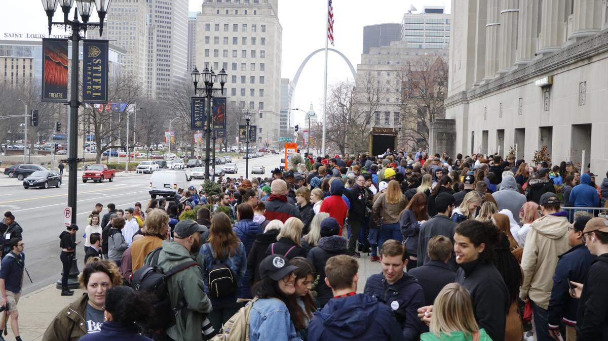 Bernie Sanders supporters gather in front of Stifel Theatre in St. Louis before a get-out-the-vote rally.